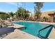 Sparkling community pool with ample lounge chairs for sunbathing at 3825 E Camelback Rd # 239, Phoenix, AZ 85018