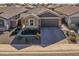 One-story home with a two-car garage and landscaped front yard at 41233 W Carlisle Ln, Maricopa, AZ 85138