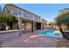 Inviting backyard featuring a refreshing pool and covered patio, perfect for outdoor entertaining at 4188 E Lexington Ave, Gilbert, AZ 85234