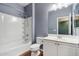 Full bathroom with combination tub and shower, a single sink vanity, and wood-look flooring at 4188 E Lexington Ave, Gilbert, AZ 85234