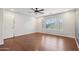 Bedroom features hardwood floors, a ceiling fan, and windows allowing natural light at 4188 E Lexington Ave, Gilbert, AZ 85234