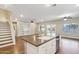 Open concept kitchen with center island and hardwood floors with view of living room at 4188 E Lexington Ave, Gilbert, AZ 85234