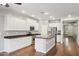 Modern kitchen featuring white cabinetry, stainless steel appliances, and a functional island at 4188 E Lexington Ave, Gilbert, AZ 85234