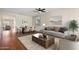 Comfortable living room with ample natural light, stylish furnishings, and a view into the dining area at 4188 E Lexington Ave, Gilbert, AZ 85234