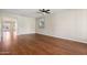 Open living space featuring hardwood floors, a ceiling fan, and a bright interior at 4188 E Lexington Ave, Gilbert, AZ 85234