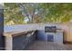 Covered outdoor kitchen featuring a built-in grill and countertop, perfect for entertaining at 4188 E Lexington Ave, Gilbert, AZ 85234