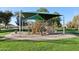 Community playground with climbing structure and protective sun shade at 4188 E Lexington Ave, Gilbert, AZ 85234
