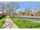 Neighborhood street lined with trees and grassy sidewalks at 4188 E Lexington Ave, Gilbert, AZ 85234