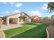 Backyard with patio and artificial turf at 45513 W Sky Ln, Maricopa, AZ 85139