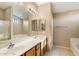 Double vanity bathroom with soaking tub and shower at 45513 W Sky Ln, Maricopa, AZ 85139