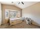 Main bedroom with bay window, ceiling fan, and carpeted floor at 45513 W Sky Ln, Maricopa, AZ 85139