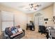 Home office with desk and sofa at 45513 W Sky Ln, Maricopa, AZ 85139