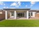 The backyard includes a covered patio and well-maintained green lawn at 5525 N 193Rd Dr, Litchfield Park, AZ 85340
