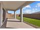 This home features a covered patio with ample space and a well-maintained lawn at 5525 N 193Rd Dr, Litchfield Park, AZ 85340