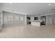 Bright living space with tile floors, recessed lighting, and a view of the modern kitchen, creating an inviting atmosphere at 5525 N 193Rd Dr, Litchfield Park, AZ 85340