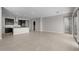 Spacious open-concept living area featuring tile flooring and neutral paint, perfect for entertaining or relaxing at 5525 N 193Rd Dr, Litchfield Park, AZ 85340