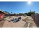 Spacious backyard with brick patio and small trees at 5543 W Gardenia Ave, Glendale, AZ 85301