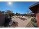 Large backyard with patio, landscaping and seating area at 5543 W Gardenia Ave, Glendale, AZ 85301
