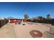 Backyard with brick patio, fire pit and small shed at 5543 W Gardenia Ave, Glendale, AZ 85301