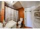 Clean bathroom with tile shower, toilet and vanity at 5543 W Gardenia Ave, Glendale, AZ 85301