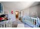 Adorable Bedroom featuring a crib and charming decor at 5543 W Gardenia Ave, Glendale, AZ 85301