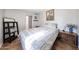 Cozy bedroom with a twin bed and wood nightstand at 5543 W Gardenia Ave, Glendale, AZ 85301
