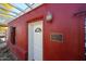 Red brick home with white pergola and a historic marker at 5543 W Gardenia Ave, Glendale, AZ 85301