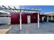 Charming red house with white pergola and address number 5543 at 5543 W Gardenia Ave, Glendale, AZ 85301