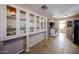 Kitchen with white cabinets, glass-front cabinets, and tile floors at 5543 W Gardenia Ave, Glendale, AZ 85301