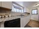 Clean kitchen with white cabinets, granite countertops, and a dishwasher at 5543 W Gardenia Ave, Glendale, AZ 85301