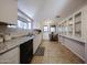 Clean and bright kitchen with white cabinets and granite countertops at 5543 W Gardenia Ave, Glendale, AZ 85301