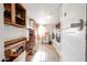 Laundry room with washer, dryer, and storage shelves at 5543 W Gardenia Ave, Glendale, AZ 85301