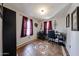 Home office with desk, chair, and tile floors at 5543 W Gardenia Ave, Glendale, AZ 85301