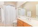 Clean bathroom with a shower/tub combo and wood vanity at 6202 E Mckellips Rd # 42, Mesa, AZ 85215