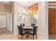Small breakfast nook with glass-top table and four chairs at 6202 E Mckellips Rd # 42, Mesa, AZ 85215
