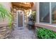 Inviting entryway with stonework, decorative fountain, and wrought-iron door at 6202 E Mckellips Rd # 42, Mesa, AZ 85215