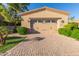 Attached garage with double doors and paver driveway at 6202 E Mckellips Rd # 42, Mesa, AZ 85215