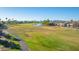 Green golf course with lake and walking path at 6202 E Mckellips Rd # 42, Mesa, AZ 85215