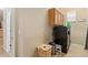 Laundry room with washer, dryer, and upper cabinets at 6202 E Mckellips Rd # 42, Mesa, AZ 85215