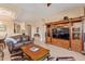 Living room with leather sofa and large built-in entertainment center at 6202 E Mckellips Rd # 42, Mesa, AZ 85215