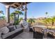 Inviting patio with seating area and grill, overlooking golf course at 6202 E Mckellips Rd # 42, Mesa, AZ 85215