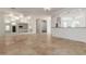 Living room with built-in entertainment center and tile floors at 6280 W Saratoga Way, Florence, AZ 85132