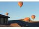 Wonderful view of hot air balloons in flight over a residential neighborhood at 6516 W Madre Del Oro Dr, Phoenix, AZ 85083