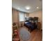 Bedroom featuring a bunk bed and a braided area rug at 6516 W Madre Del Oro Dr, Phoenix, AZ 85083
