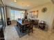 Formal dining room featuring a wooden table and chairs, tile flooring, and contemporary decor at 6516 W Madre Del Oro Dr, Phoenix, AZ 85083