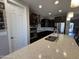 Modern kitchen with stainless steel appliances, mosaic tile backsplash, and quartz countertops at 6516 W Madre Del Oro Dr, Phoenix, AZ 85083