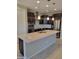 This spacious kitchen features a large island, stainless steel appliances, and dark wood cabinetry at 6516 W Madre Del Oro Dr, Phoenix, AZ 85083