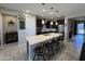 Contemporary kitchen with a large island, dark cabinetry, and stainless steel appliances at 6516 W Madre Del Oro Dr, Phoenix, AZ 85083