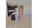 Spacious eat-in kitchen features a large island with light countertops and stainless appliances at 6516 W Madre Del Oro Dr, Phoenix, AZ 85083