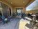Covered patio featuring comfortable seating, a patterned rug, and outdoor decor at 6516 W Madre Del Oro Dr, Phoenix, AZ 85083